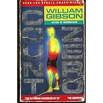 Book cover. Somewhat battered. Blue background with writing going down either side of a figure of a man facing to the left. The figure is part yellow, part red, part black, and glows. The writing is mixed grey and dark grey and says COUNT ZERO. At the top if a red strapline with white writing reading HUGO AND NEBULA AWARD-WINNER. Below that, and right-aligned is a yellow box with WILLIAM GIBSON in green writing, below that a smaller, green, box with AUTHOR OF NEUROMANCER in white writing. At the bottom, another red strapline saying 'THE RAYMOND CHANDLER OF SF' and then, to the right, THE OBSERVER. 