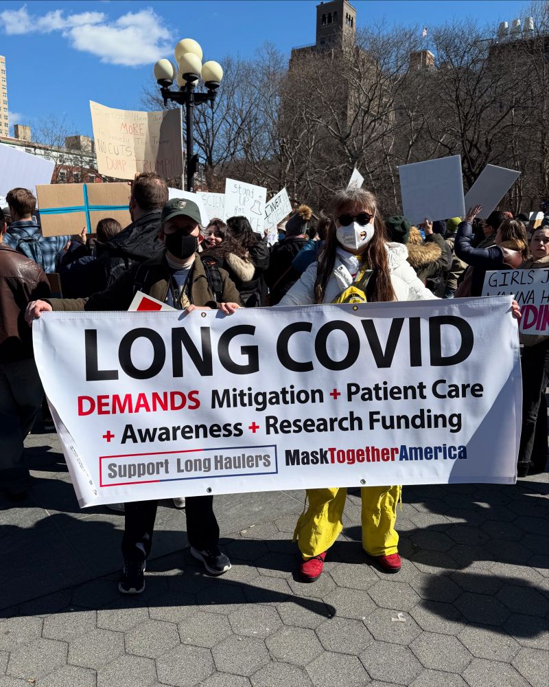 “Long COVlD demands Mitigation + Patient Care + Awareness + Research Funding. Support Long Haulers. MaskTogetherAmerica!” Joining Stand Up for Science rallies across the US to protest funding cuts, illegal firings, and censorship of scientists is Julie Lam and Dr. Corthals representing the MaskTogetherAmerica Team! Change never happens without people coming together to demand it. See bit.ly/Fight4HealthJustice for ways to take action!