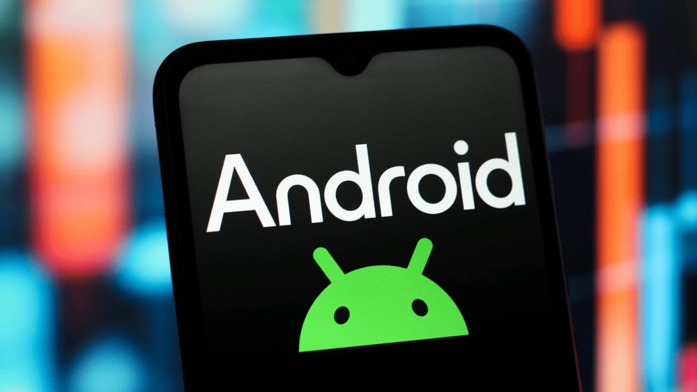 A smartphone screen displaying the Android logo with a colorful blurred background, symbolizing the Android operating system