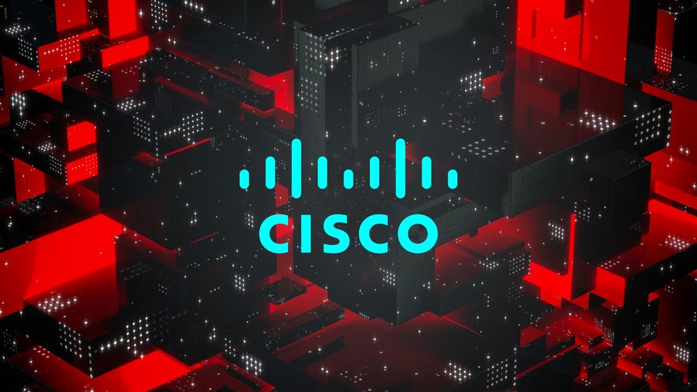 Abstract red and black digital background with the Cisco logo in the center, representing a cybersecurity incident affecting Cisco infrastructure.
