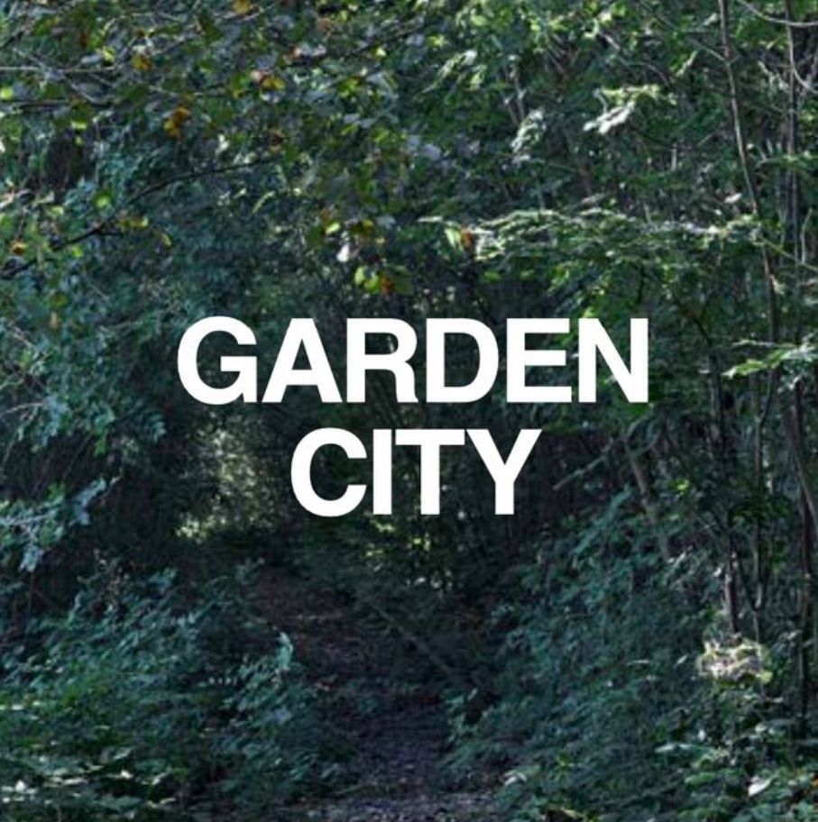 Forest background with font saying: Garden City