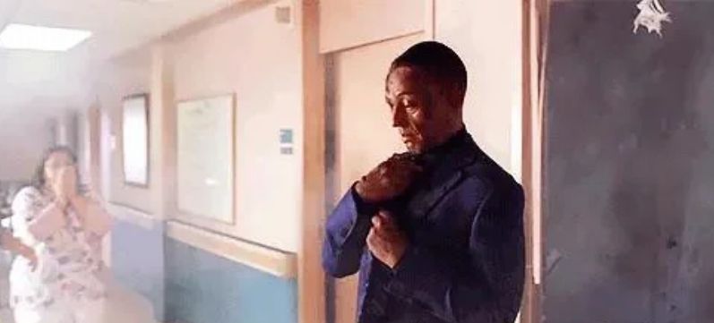 Gus Fring adjusts his tie as a nurse looks on in horror after Hector blows himself up along with half of Gus’s face.