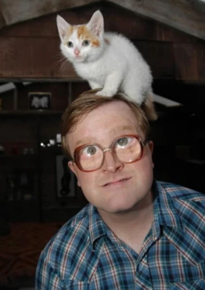 Bubbles from Trailer Park Boys with a cute white and orange kitty on his head.