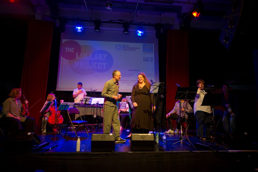 A photo showing an ensemble of classical musicians on a stage