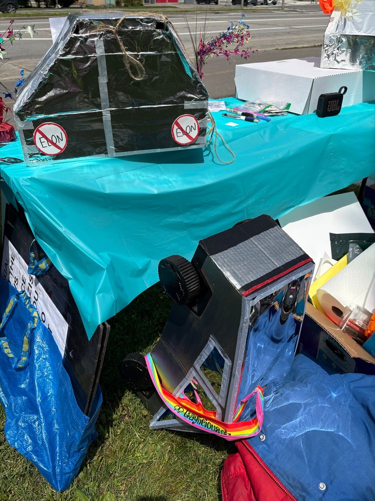 Image of a cybertruck piñata upside down on the ground proving that even the fake ones can’t withstand the tiniest challenge. Just like the real thing! 