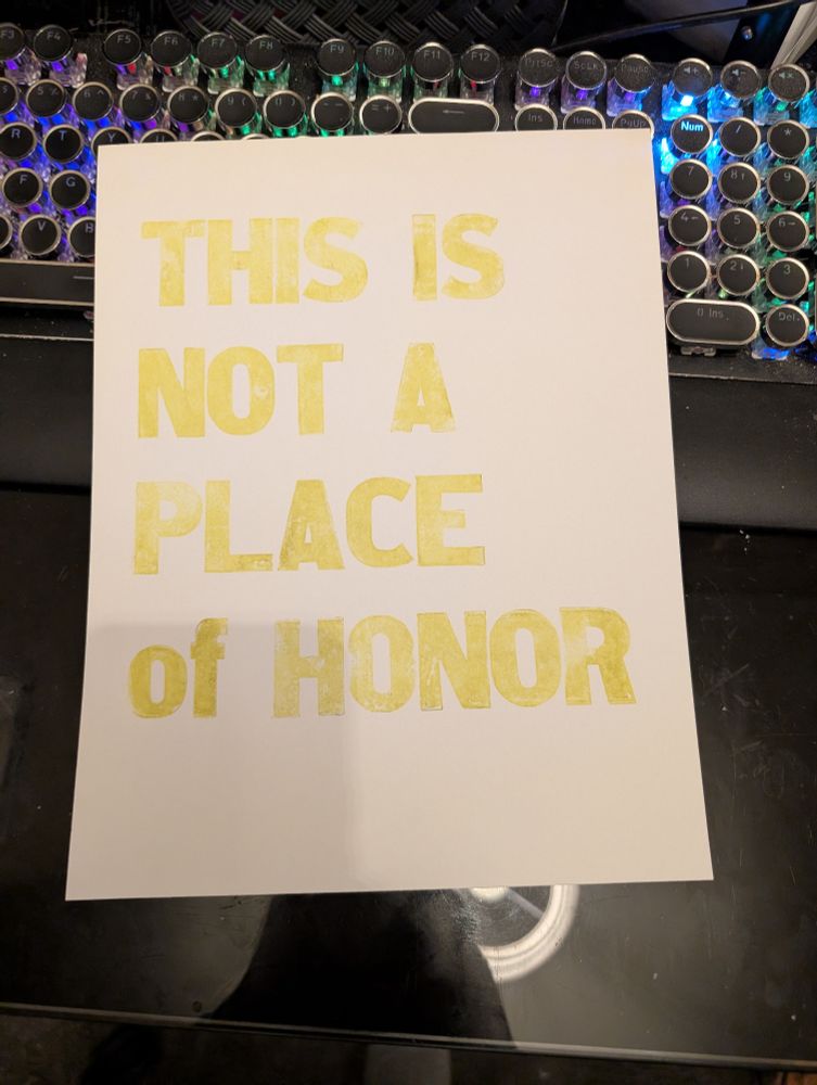 THIS IS NOT A PLACE of HONOR in yellow ink printed from hand set wooden tape