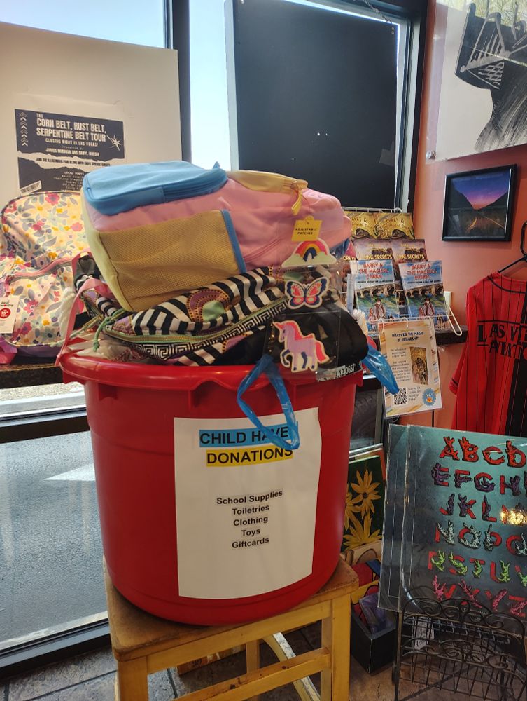 A large red bin filled with donations to child Haven 