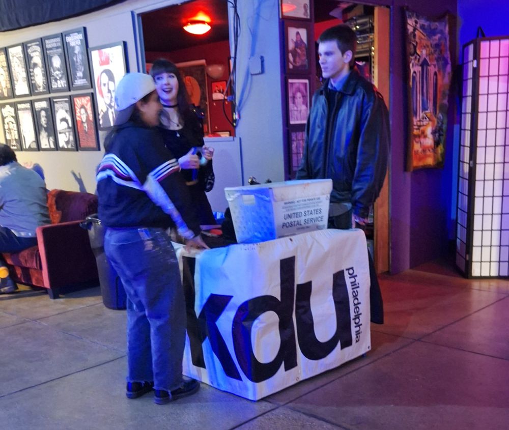 WKDU radio DJs setting up their table.