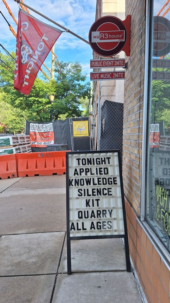 Sandwich board that says: tonight, applied knowledge, the silence kit and quarry