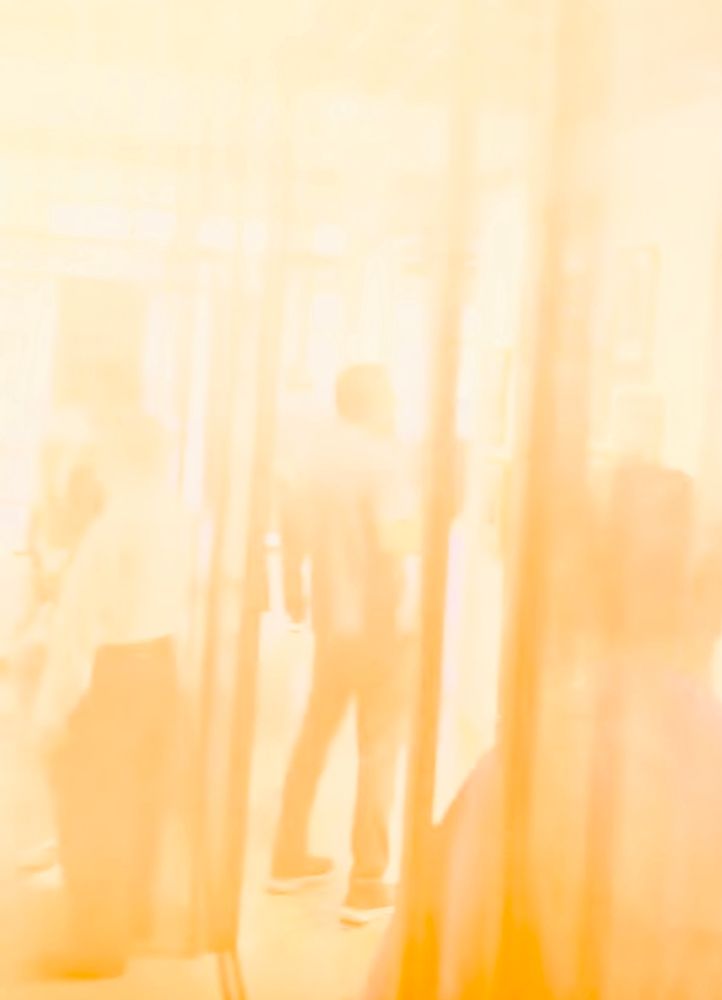 Hazy atmospheric photo of people in an art gallery