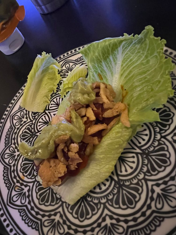 Dish with mandala pattern holding lettuce wrap 
