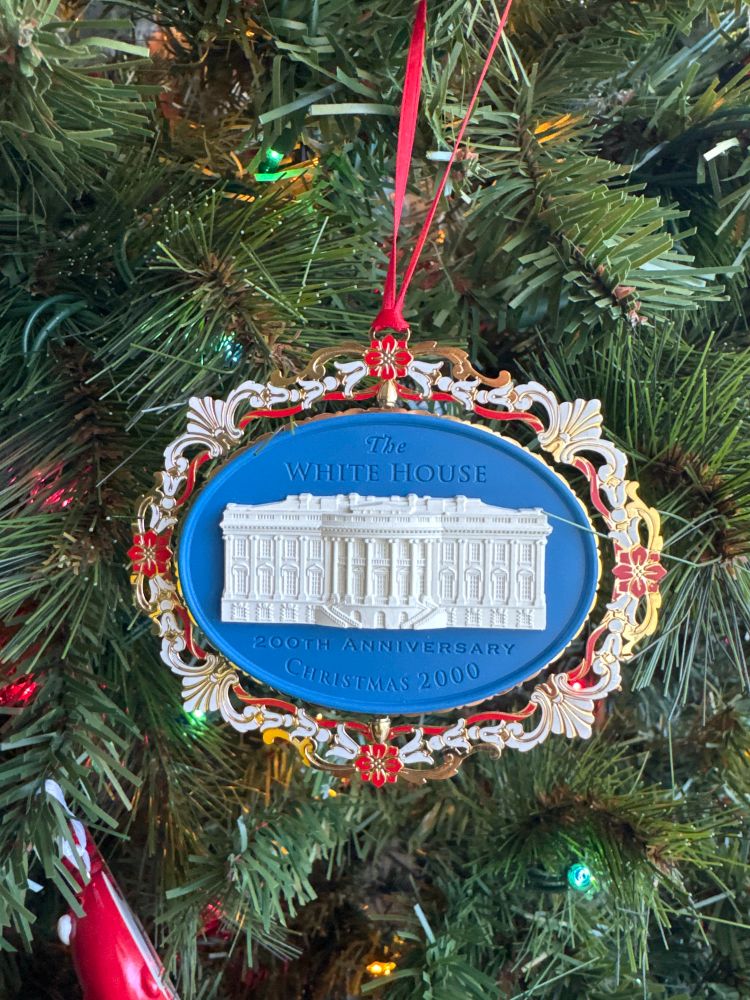 Ornament on Christmas tree with White House over blue background. Words say: The White House, 200th Anniversary, Christmas 2000