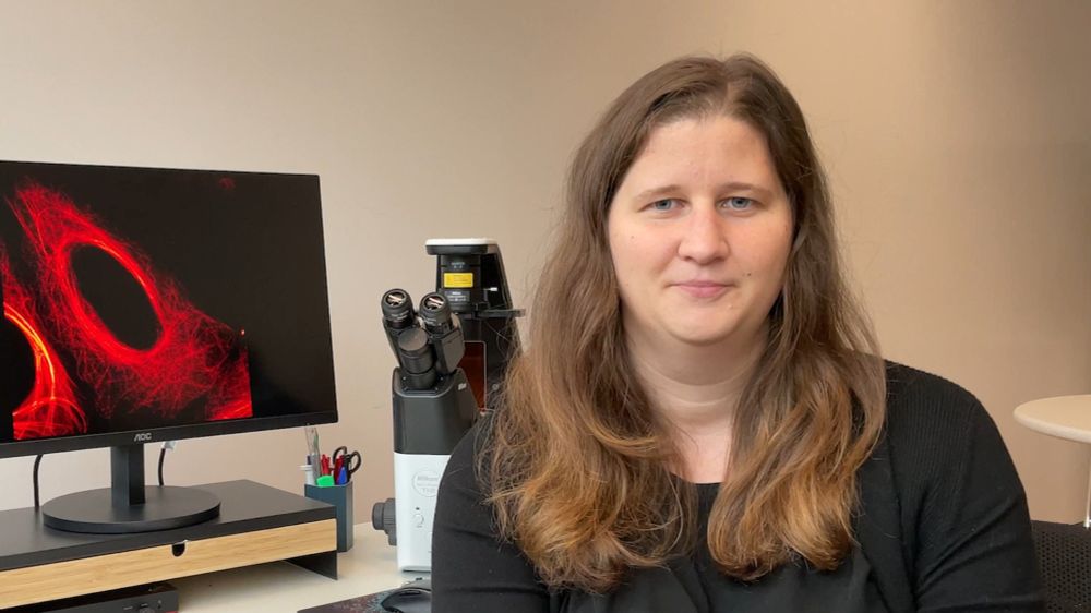 person in front of microscope and microscopy image