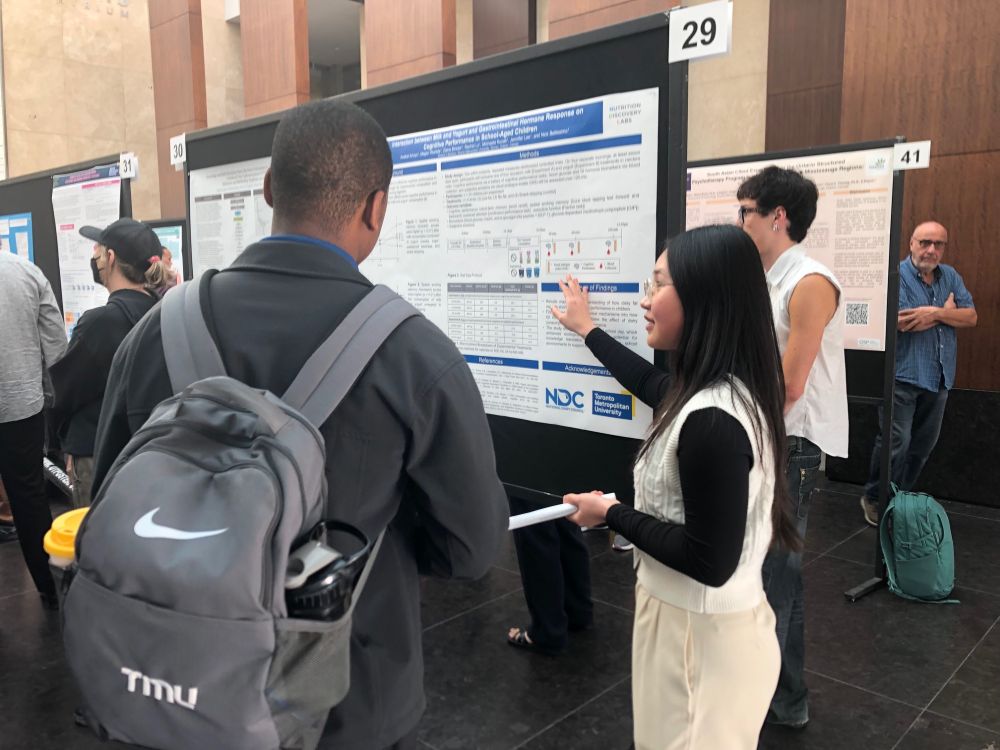 A presenter explains her research at the URO Showcase.
