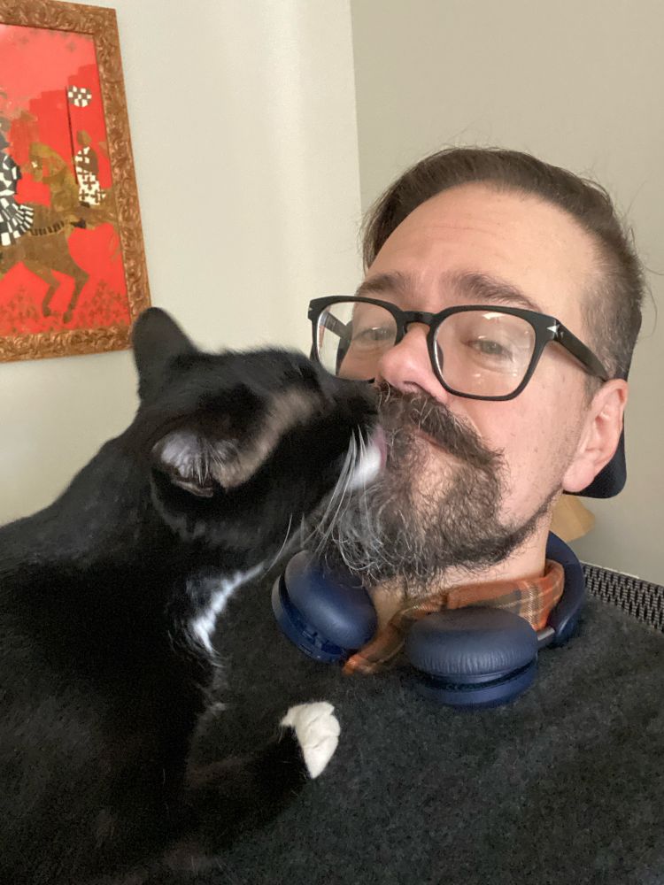 Mr. Bistro’s cat, Biscuit, is licking his beard. His beard is now ick.