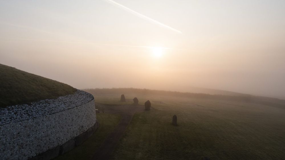 Newgrange and a misty sunrise.