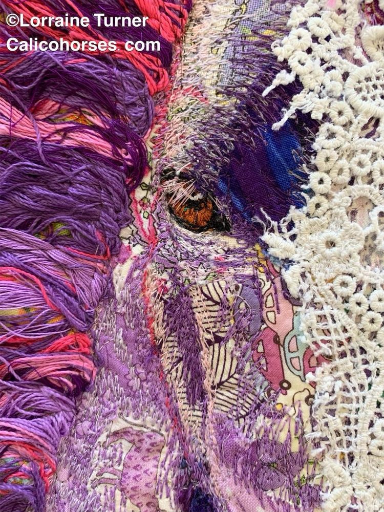 A purple and magenta horse with a white lace blaze and brown eyes all sewn together 