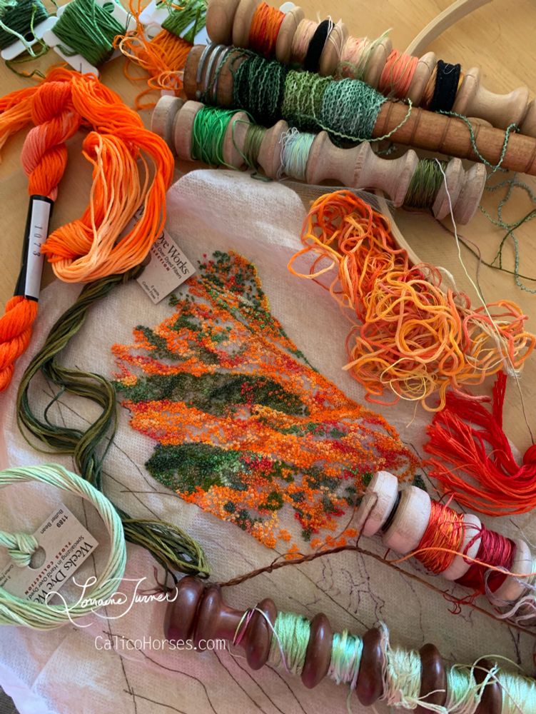 Orange, red, gold and green embroidered poppies created with a blend of dyed silk embroidery floss