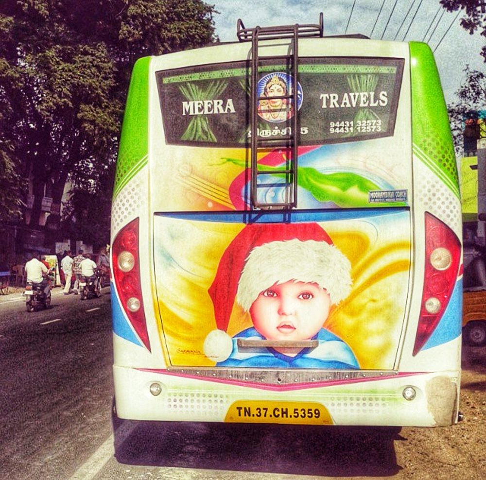 Rear of an Indian private bus with an image of a child wearing a Santa hat.

Christmas in India is always a little surreal. Outside of the tiny Christian population, there's little to tell it is actually happening - no carols, no ornament-laden trees, no manic advertising. 

But when you least expect it, something like this appears!!!
