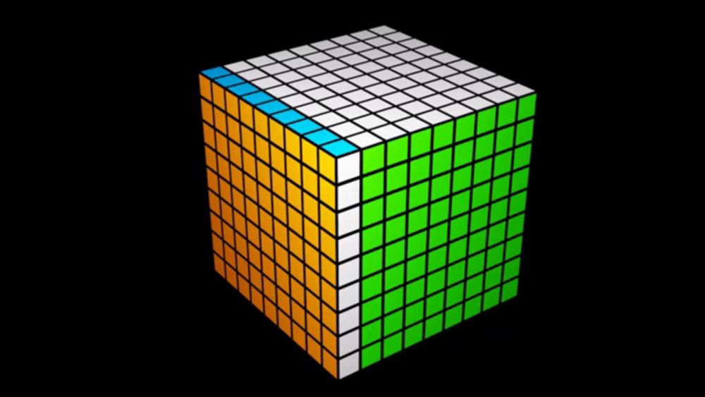 a green and yellow rubik 's cube on a black background with a white square in the middle