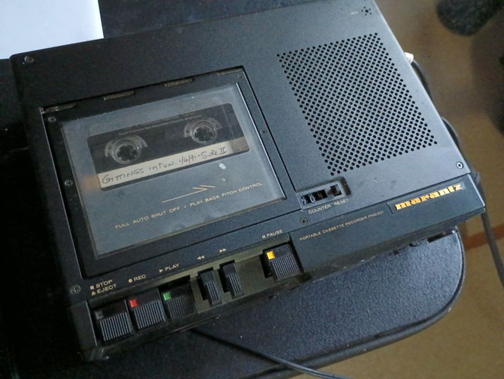 An audiocassette machine playing a tape labeled "Gittings interview, January 6, 1991, Side 2."