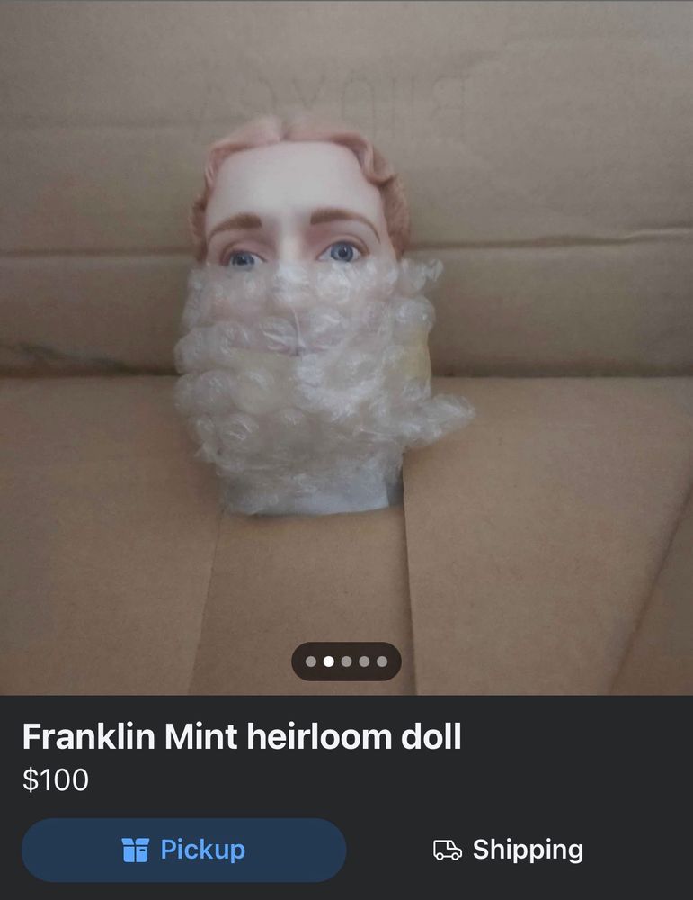 A screenshot of a doll with the mouth covered in bubble wrap