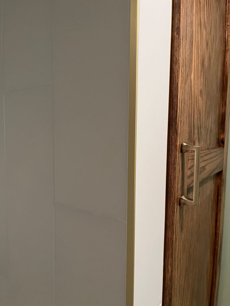 Gold schluter by shower