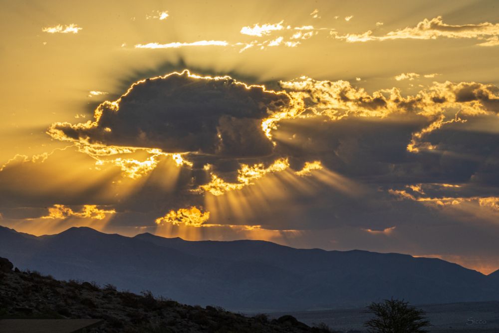 Crepuscular rays radiating from a large cloud formation near the Reserve Tuesday morning. 