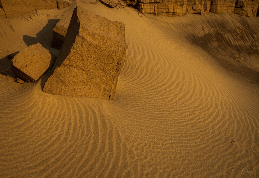 Sand ripples around a chunk of a caved in flood channel this morning east of Borrego Springs.