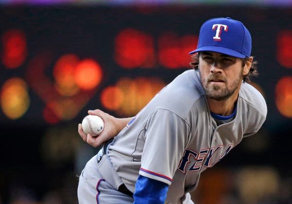 Cole Hamels in a Rangers uniform. It looks weird.