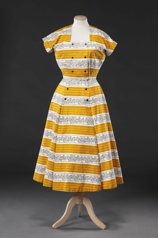 Front view of Horrockses printed cotton sun dress with short matching jacket, early 1950s. Bright yellow & white alternate as grounds for delicate stripes & flowers executed in short black hatched lines, JB