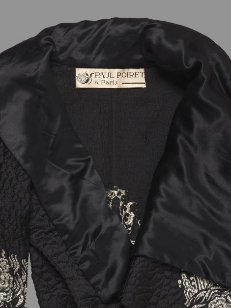 Close up showing label on the c1921 coat which reads ‘Paul Poiret à Paris’, JB