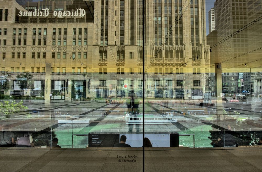In front of the Chicago Tribune, the glass walls of the Equitable Building create a fabulous visual experience that allows a kaleidoscope formed by the river and its boats, the people inside the building and the reflections of the Chicago Tribune, a fantastic Chicago cityscape in a single mosaic.
#chicago  #storytelling #luiscordobapharchive  #eastcoastkin #scape  #art   #picoftheday #urbangaze #city
 #photographer ⁠
 go to SCAPE 🔝📷▶️ here;
https://bsky.app/profile/did:plc:gkdzhhasll5lweby2pnakh3c/feed/aaahz7avjwmia