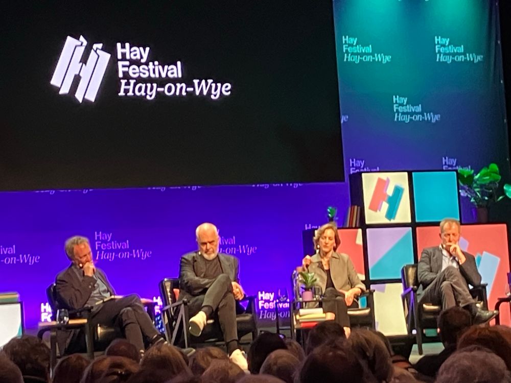 Photo of panellists having a discussion during the Hay Festival.