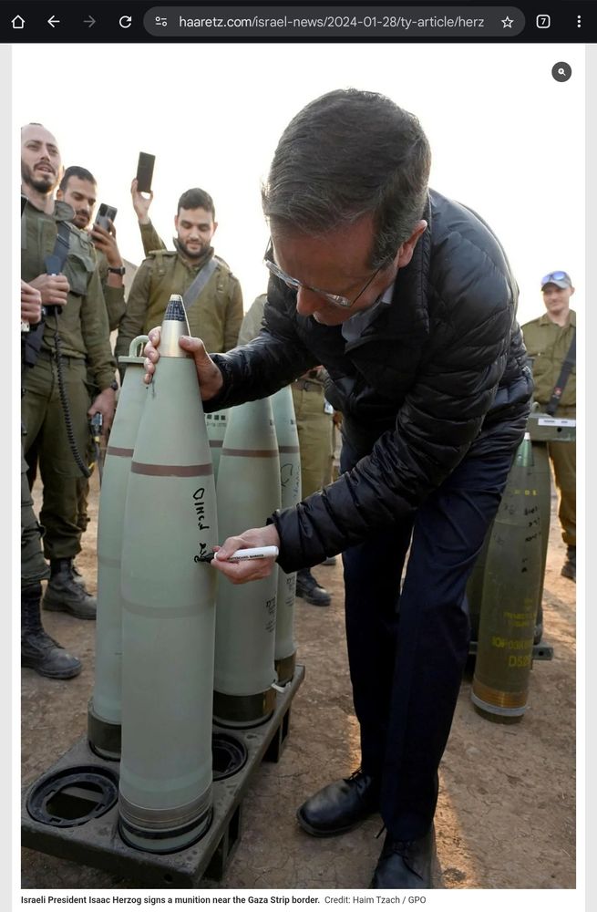 Herzog signing a bomb.