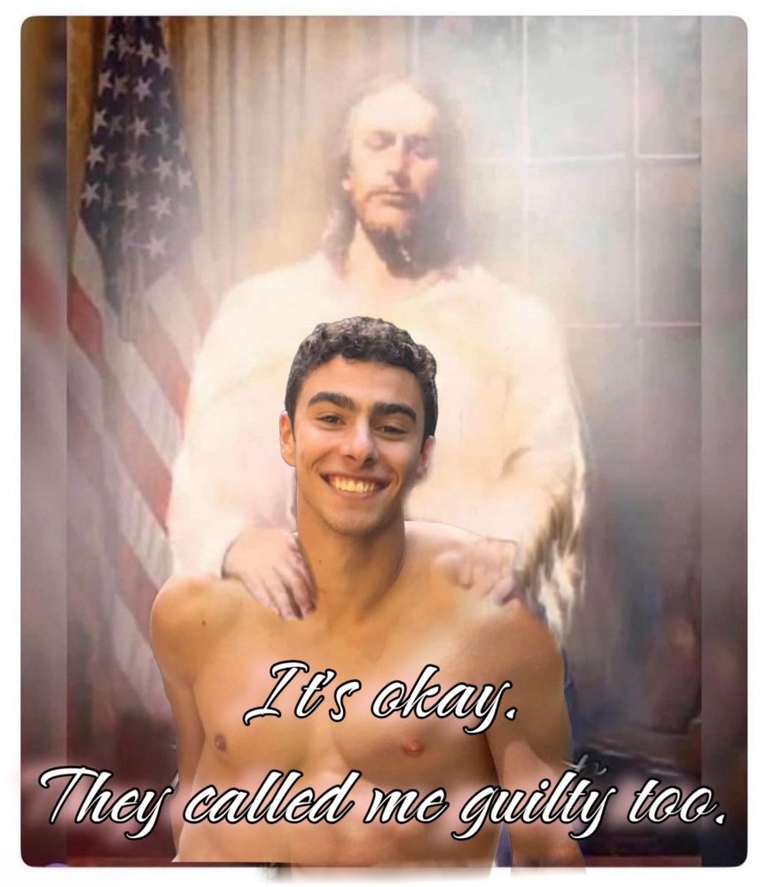 airbrushed photoshop of jesus putting his hands on the shoulders of a shirtless luigi mangione; an american flag is in the background & text says “it’s okay. they called me guilty too.”