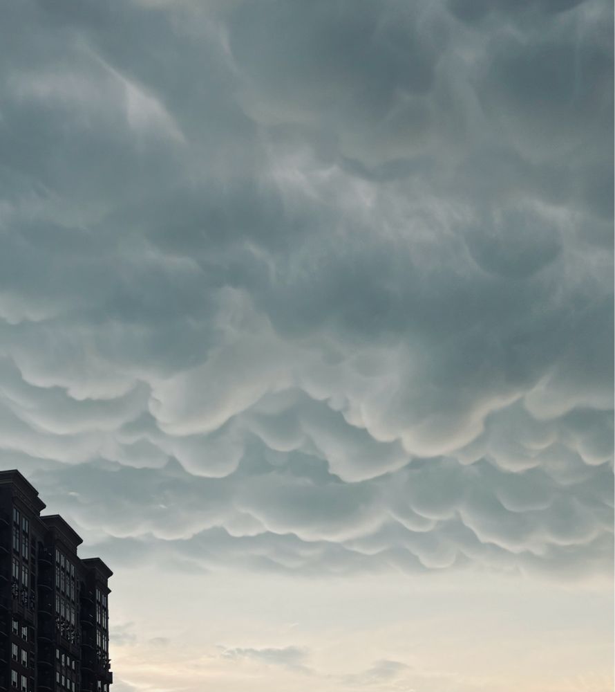 mammatus clouds (often indicative of a storm) forming overhead.