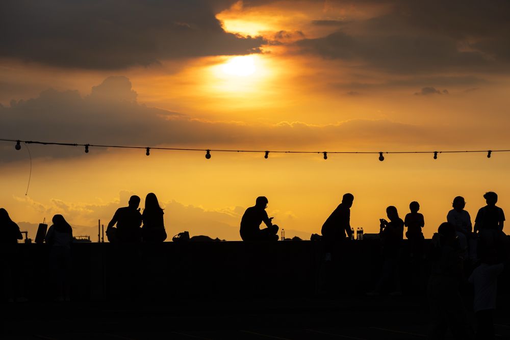 Silhouettes of sunset watchers