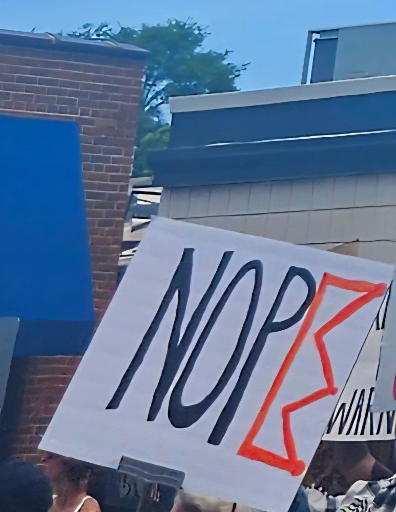 The word NOPE and the E is in the shape of a crown
