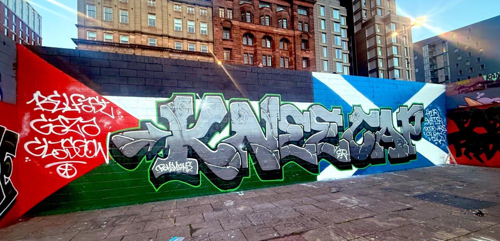 Graffiti "Kneecap" with Palestine and Scottish flags