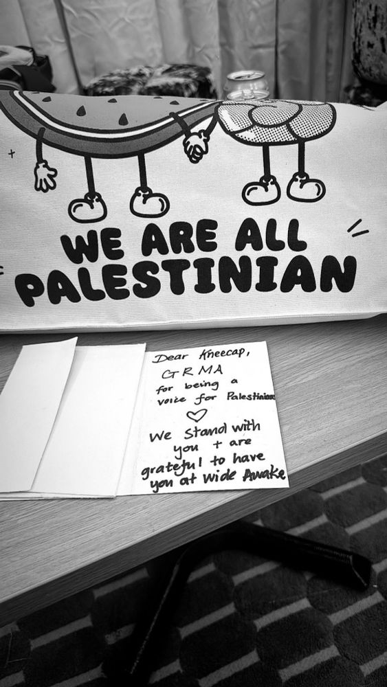 A card from the organisers of the Wide Awake festival: "Dear Kneecap, GRMA for being a voice for Palestine. We stand with you + are gratefulto have you at Wide Awake"