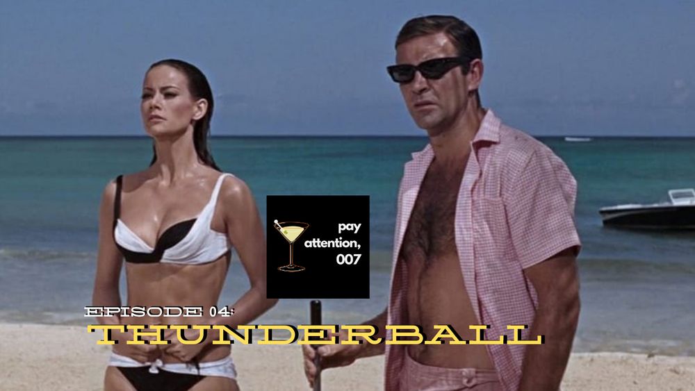 A screen shot from Thunderball. Domino is wearing a black and white bikini and standing to the left of Bond who is wearing a pink shortsleeve button up shirt that is unbottoned. In the center it has the Pay Attention, 007 logo and below reads "Episode 04: Thunderball." The beach and ocean are behind them.