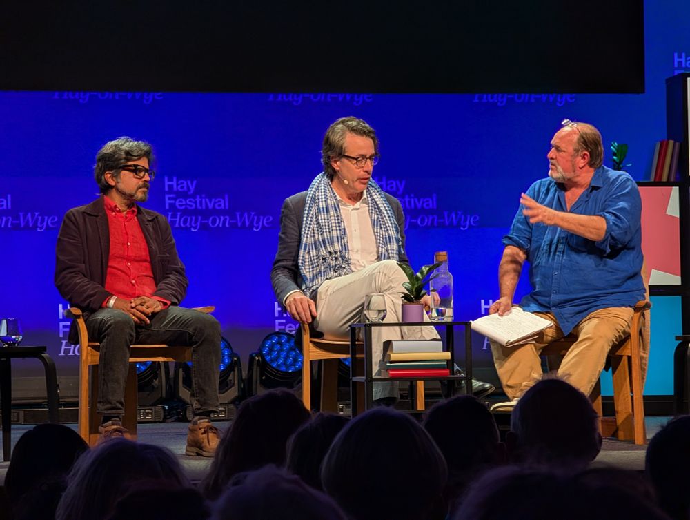 Pankaj Mishra, Benjamin Moser and William Dalrymple sit on stage at the Hay Festival 
