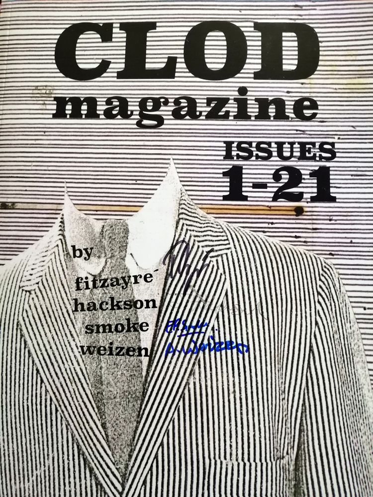 Front cover of Clod Magazine anothology, showing a white and black narrow horizontal striped background, and a headless suit jacket in the same print but vertical. 