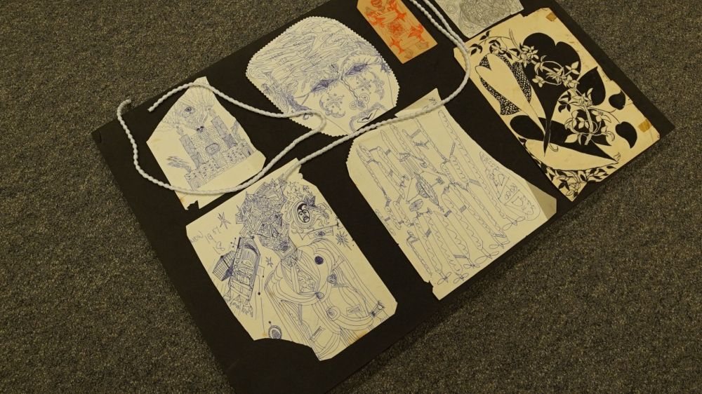 Archive of Mustapha Matura, showing a collection of doodles.
