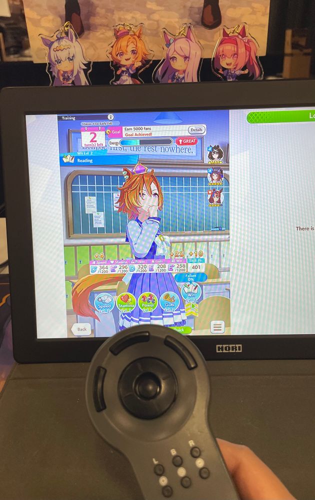 Photo of umamusume on a portable hori monitor hooked up to a steam deck with a reproduction Phillips cdi controller 