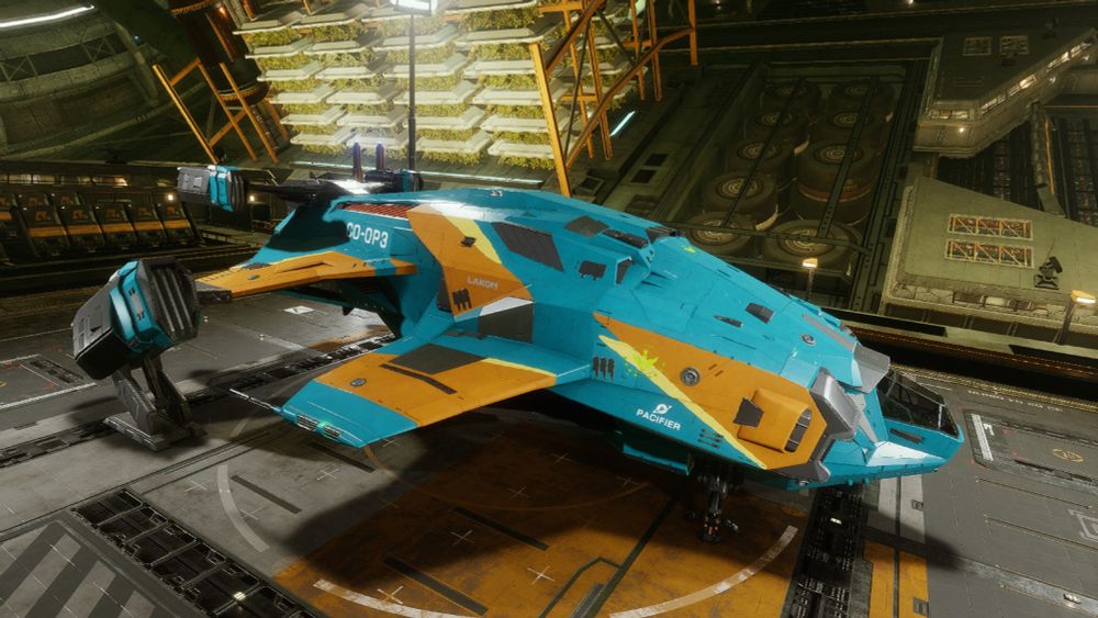 A hangar shot with hydroponics in the background, featured is my Alliance Challenger ship with identification listed at the tail reading CO-OP3. The name of the ship is also listed, it's Pacifier. The ship is in the Alliance color teal, featuring yellow and orange. It has Nakato Kaine-green colored rank decals.