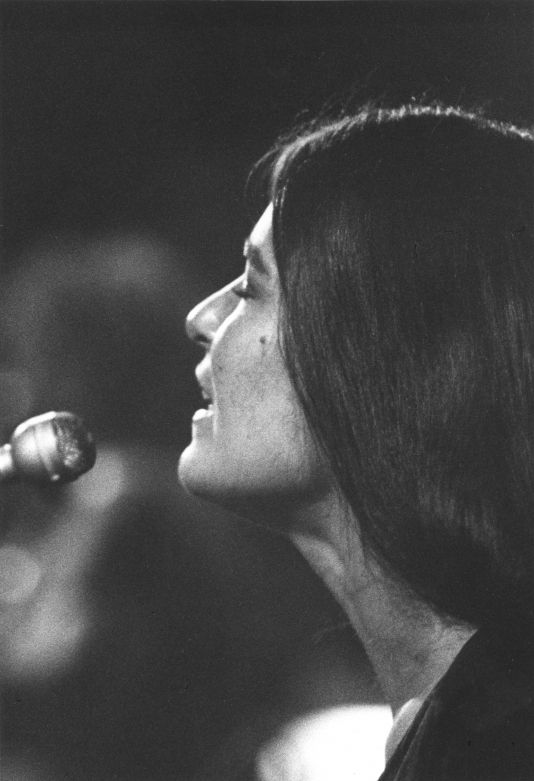 Donna Jean of the Grateful Dead singing into a mic