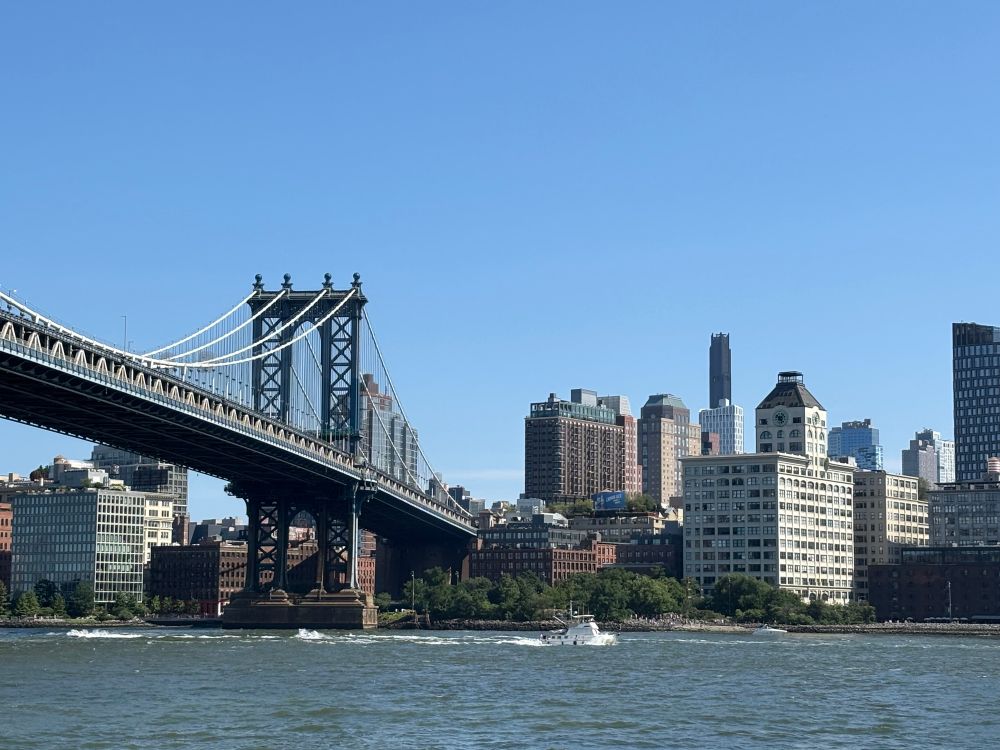 View of the Manhattan Bridge and Brooklyn on a sunny day