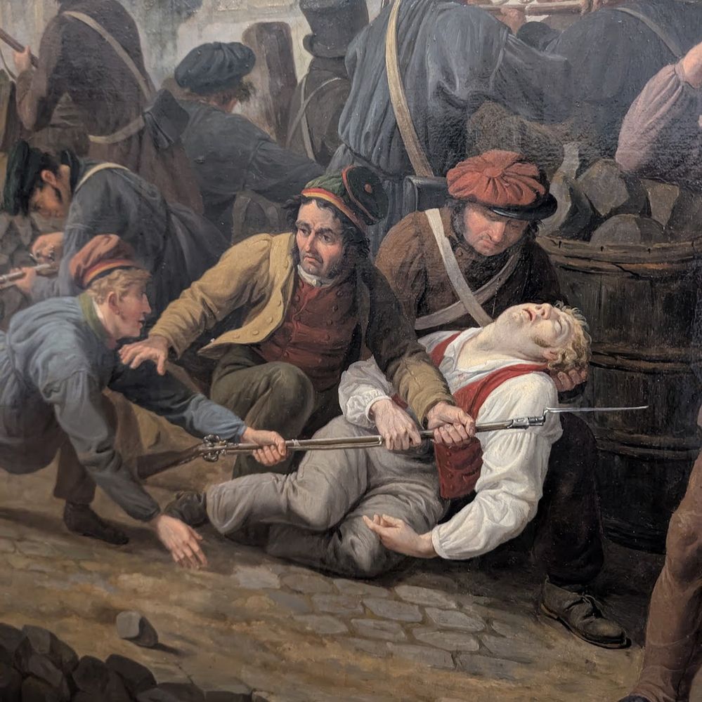 scène de combat intense, où des soldats, reconnaissables à leur équipement du XIXᵉ siècle (notamment la baïonnette et les uniformes typiques), sont à terre, blessés ou aidés par des camarades. Ce type de représentation se retrouve fréquemment dans les tableaux inspirés des guerres du XIXᵉ siècle, notamment la guerre de 1870 ou les campagnes napoléoniennes. Les détails (uniformes, baïonnettes, gestes de secours entre soldats) sont caractéristiques d’une peinture académique historiciste illustrant la brutalité des affrontements et la solidarité des combattants.

Le style et la composition, avec un accent sur les blessés au sol et les baïonnettes, rappellent des œuvres majeures comme celles d’Édouard Detaille ou d’Alphonse de Neuville, célèbres pour avoir représenté la guerre franco-prussienne de 1870 de façon très réaliste, mais aussi des fresques comme "Le panorama de la bataille de Champigny" (1881-1882), où les scènes de blessés à terre et secourus sont fréquentes. Dans ces œuvres, la souffrance individuelle et le chaos de la bataille sont mis en avant, de même que la tension dramatique de l’instant.

Il est donc probable que ce tableau appartienne à la tradition picturale des scènes de bataille du XIXᵉ siècle — très probablement lié à la guerre de 1870 — et que l’auteur soit l’un des peintres spécialisés dans ces représentations (comme Detaille ou de Neuville). Je n'ai malheureusement pas pris la peine de noter la référence exacte. Il figure dans les wtf parce qu'on pourrait tout aussi bien détourner cette scène comme faisant suite à une beuverie.